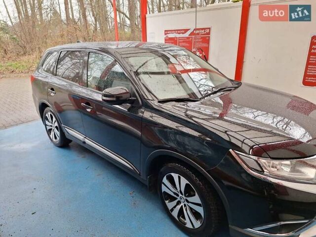 Чорний Міцубісі Аутлендер, об'ємом двигуна 2 л та пробігом 114 тис. км за 17600 $, фото 7 на Automoto.ua