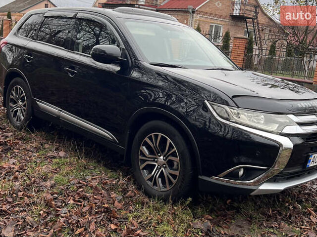 Чорний Міцубісі Аутлендер, об'ємом двигуна 2.36 л та пробігом 110 тис. км за 17500 $, фото 2 на Automoto.ua