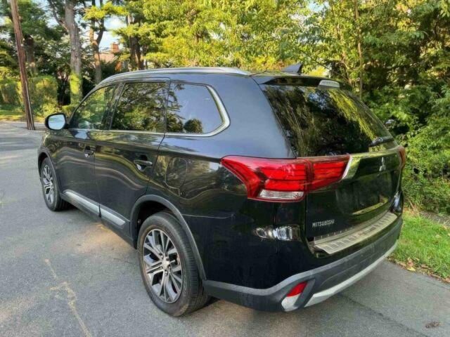 Черный Мицубиси Аутлендер, объемом двигателя 2.4 л и пробегом 66 тыс. км за 10650 $, фото 4 на Automoto.ua