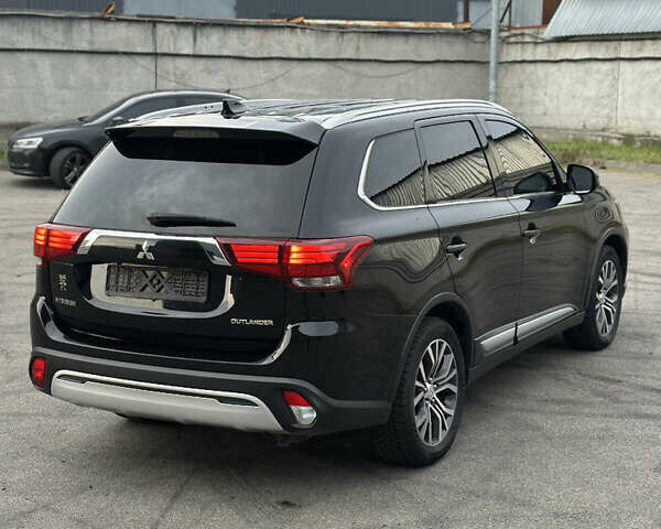 Черный Мицубиси Аутлендер, объемом двигателя 2.36 л и пробегом 128 тыс. км за 15500 $, фото 10 на Automoto.ua