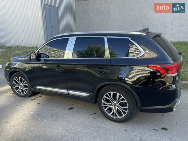 Чорний Міцубісі Аутлендер, об'ємом двигуна 2.36 л та пробігом 150 тис. км за 13500 $, фото 2 на Automoto.ua