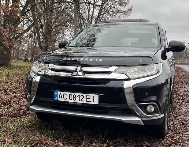 Чорний Міцубісі Аутлендер, об'ємом двигуна 2.36 л та пробігом 110 тис. км за 17500 $, фото 1 на Automoto.ua