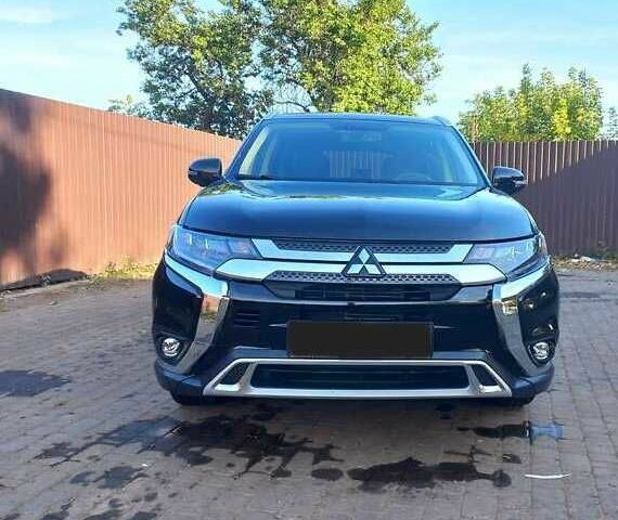 Черный Мицубиси Аутлендер, объемом двигателя 2.4 л и пробегом 132 тыс. км за 17600 $, фото 2 на Automoto.ua