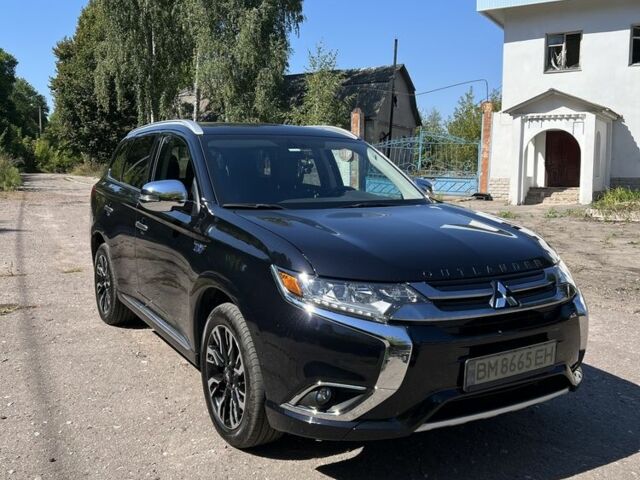 Черный Мицубиси Аутлендер, объемом двигателя 2 л и пробегом 54 тыс. км за 20800 $, фото 1 на Automoto.ua