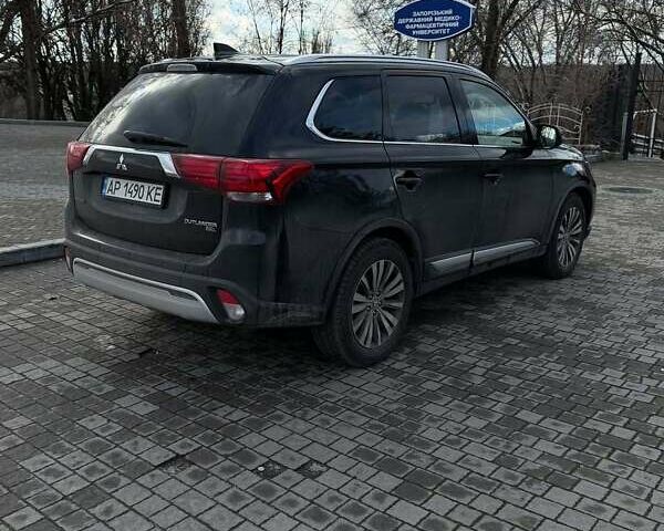 Черный Мицубиси Аутлендер, объемом двигателя 2.36 л и пробегом 91 тыс. км за 18300 $, фото 4 на Automoto.ua
