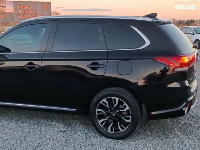 Черный Мицубиси Аутлендер, объемом двигателя 2 л и пробегом 115 тыс. км за 23700 $, фото 4 на Automoto.ua
