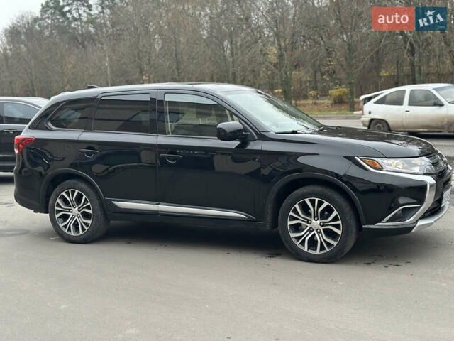 Чорний Міцубісі Аутлендер, об'ємом двигуна 2.36 л та пробігом 169 тис. км за 13450 $, фото 5 на Automoto.ua