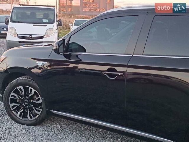Чорний Міцубісі Аутлендер, об'ємом двигуна 2 л та пробігом 115 тис. км за 23700 $, фото 3 на Automoto.ua