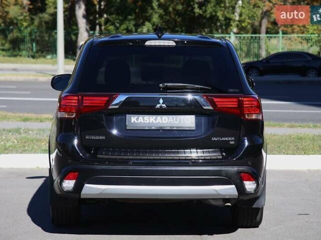 Черный Мицубиси Аутлендер, объемом двигателя 2.4 л и пробегом 130 тыс. км за 16200 $, фото 4 на Automoto.ua
