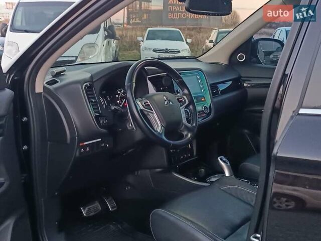 Чорний Міцубісі Аутлендер, об'ємом двигуна 2 л та пробігом 115 тис. км за 23700 $, фото 19 на Automoto.ua