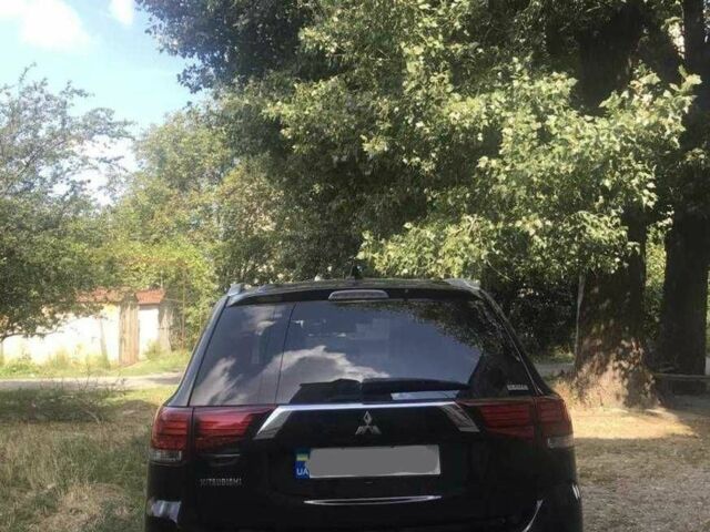 Черный Мицубиси Аутлендер, объемом двигателя 2.4 л и пробегом 125 тыс. км за 11200 $, фото 3 на Automoto.ua