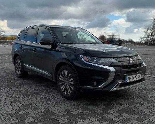 Черный Мицубиси Аутлендер, объемом двигателя 2.36 л и пробегом 91 тыс. км за 18300 $, фото 2 на Automoto.ua