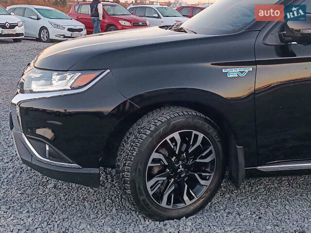 Чорний Міцубісі Аутлендер, об'ємом двигуна 2 л та пробігом 115 тис. км за 23700 $, фото 1 на Automoto.ua