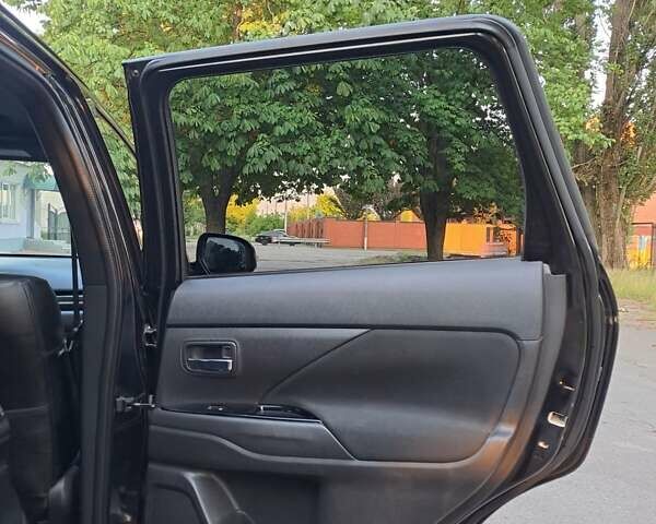 Чорний Міцубісі Аутлендер, об'ємом двигуна 2.4 л та пробігом 140 тис. км за 14800 $, фото 19 на Automoto.ua