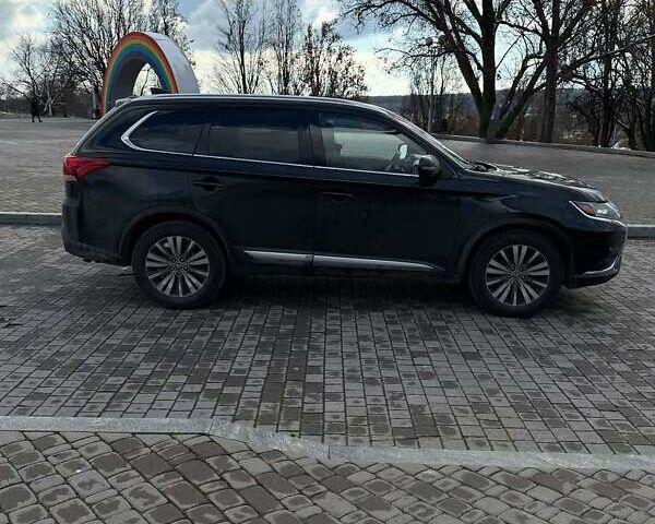 Черный Мицубиси Аутлендер, объемом двигателя 2.36 л и пробегом 91 тыс. км за 18300 $, фото 3 на Automoto.ua
