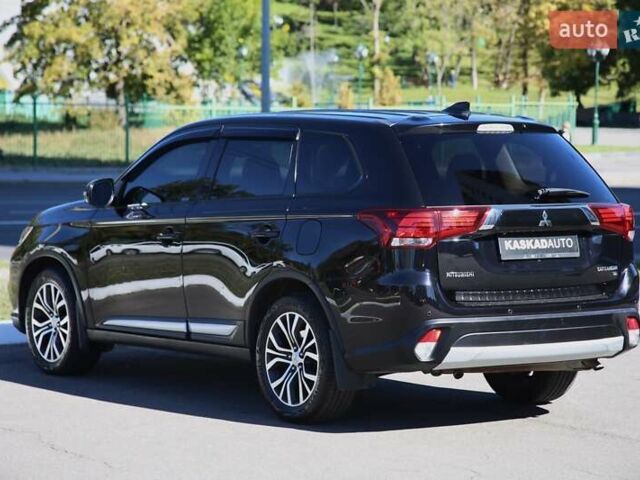 Черный Мицубиси Аутлендер, объемом двигателя 2.4 л и пробегом 130 тыс. км за 16200 $, фото 3 на Automoto.ua