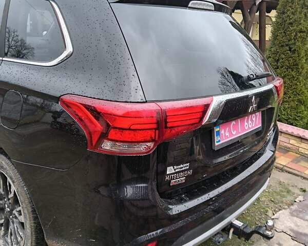 Чорний Міцубісі Аутлендер, об'ємом двигуна 2 л та пробігом 96 тис. км за 22000 $, фото 2 на Automoto.ua