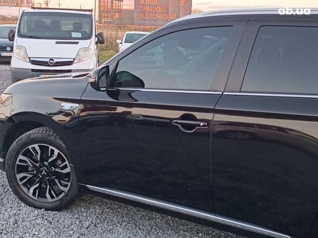 Черный Мицубиси Аутлендер, объемом двигателя 2 л и пробегом 115 тыс. км за 23700 $, фото 3 на Automoto.ua