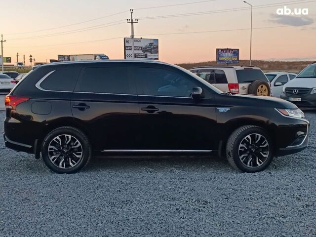 Черный Мицубиси Аутлендер, объемом двигателя 2 л и пробегом 115 тыс. км за 23700 $, фото 10 на Automoto.ua