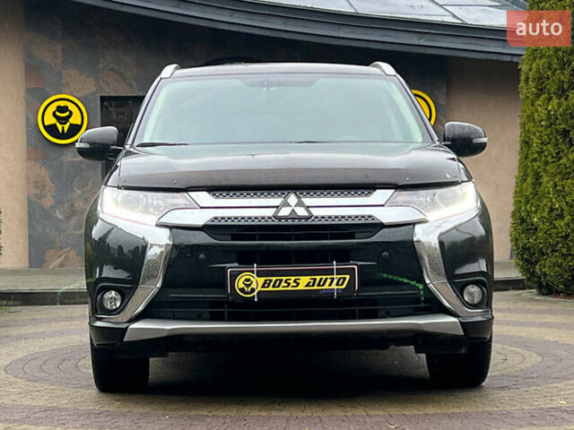 Черный Мицубиси Аутлендер, объемом двигателя 2 л и пробегом 96 тыс. км за 22750 $, фото 1 на Automoto.ua