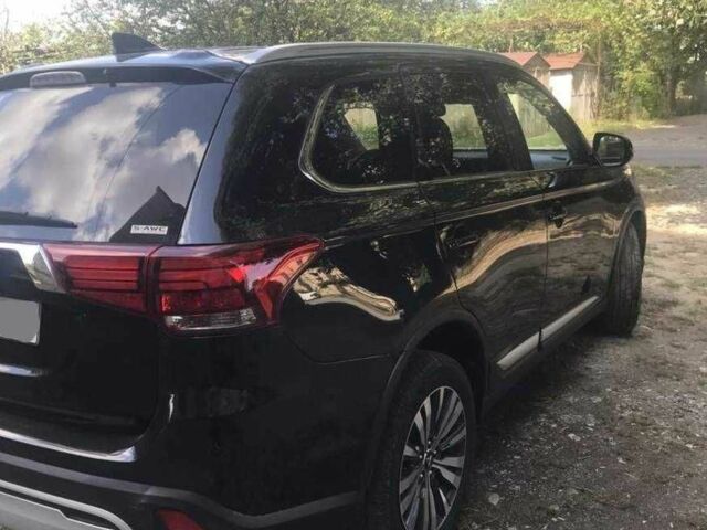 Черный Мицубиси Аутлендер, объемом двигателя 2.4 л и пробегом 125 тыс. км за 11200 $, фото 7 на Automoto.ua