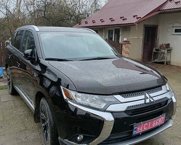 Чорний Міцубісі Аутлендер, об'ємом двигуна 2 л та пробігом 96 тис. км за 22000 $, фото 1 на Automoto.ua