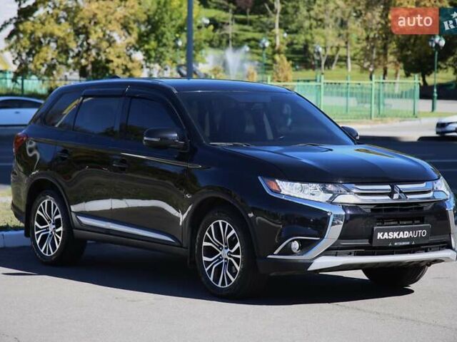 Черный Мицубиси Аутлендер, объемом двигателя 2.4 л и пробегом 130 тыс. км за 16200 $, фото 2 на Automoto.ua