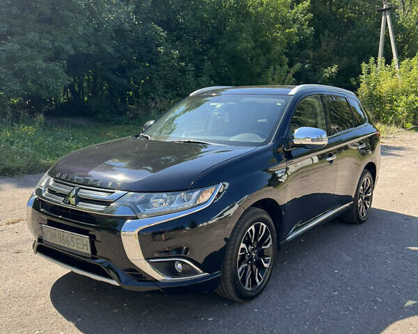 Черный Мицубиси Аутлендер, объемом двигателя 2 л и пробегом 54 тыс. км за 21500 $, фото 1 на Automoto.ua