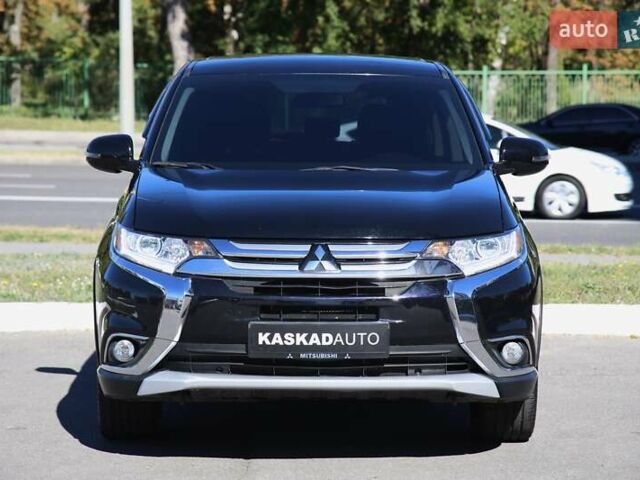 Черный Мицубиси Аутлендер, объемом двигателя 2.4 л и пробегом 130 тыс. км за 16200 $, фото 1 на Automoto.ua