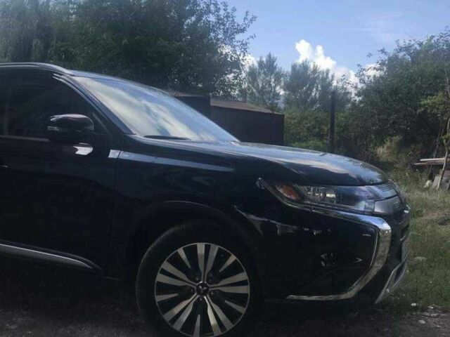 Черный Мицубиси Аутлендер, объемом двигателя 2.4 л и пробегом 125 тыс. км за 11200 $, фото 2 на Automoto.ua