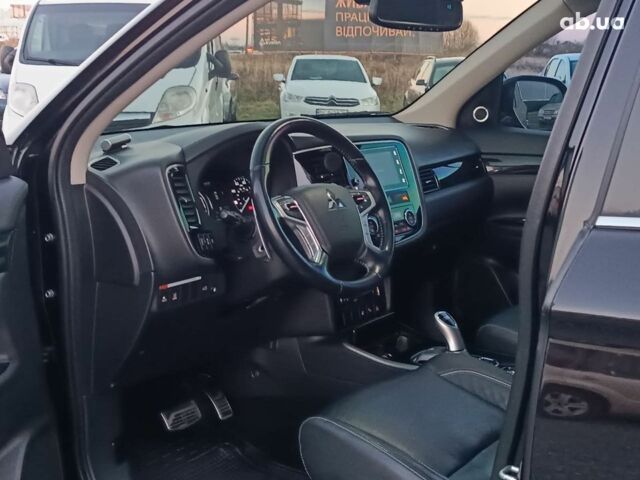 Черный Мицубиси Аутлендер, объемом двигателя 2 л и пробегом 115 тыс. км за 23700 $, фото 19 на Automoto.ua