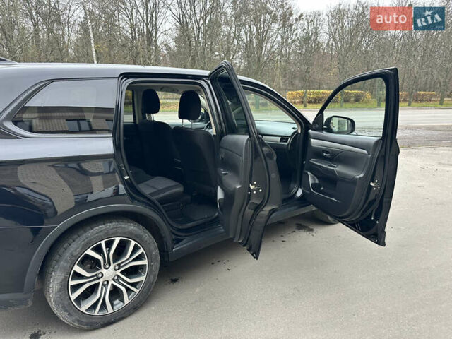 Чорний Міцубісі Аутлендер, об'ємом двигуна 2.36 л та пробігом 169 тис. км за 13450 $, фото 20 на Automoto.ua