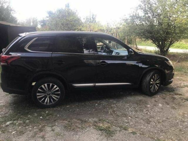 Черный Мицубиси Аутлендер, объемом двигателя 2.4 л и пробегом 125 тыс. км за 11200 $, фото 5 на Automoto.ua