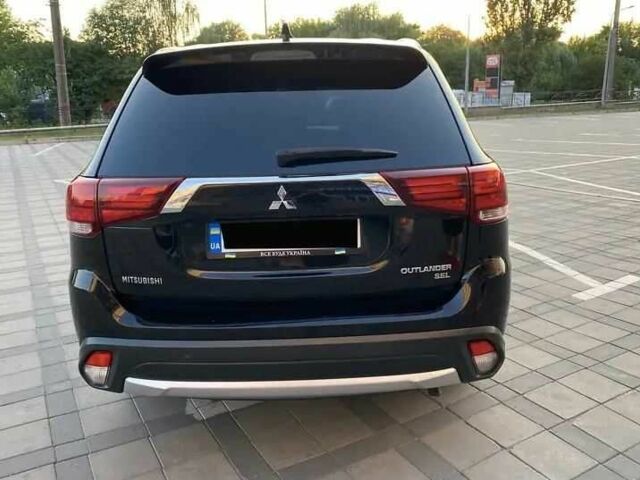 Черный Мицубиси Аутлендер, объемом двигателя 2.4 л и пробегом 75 тыс. км за 13000 $, фото 4 на Automoto.ua