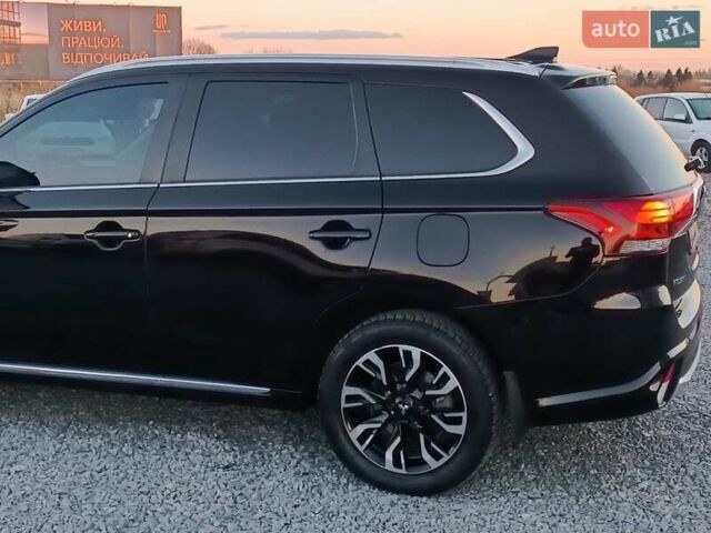 Чорний Міцубісі Аутлендер, об'ємом двигуна 2 л та пробігом 115 тис. км за 23700 $, фото 4 на Automoto.ua
