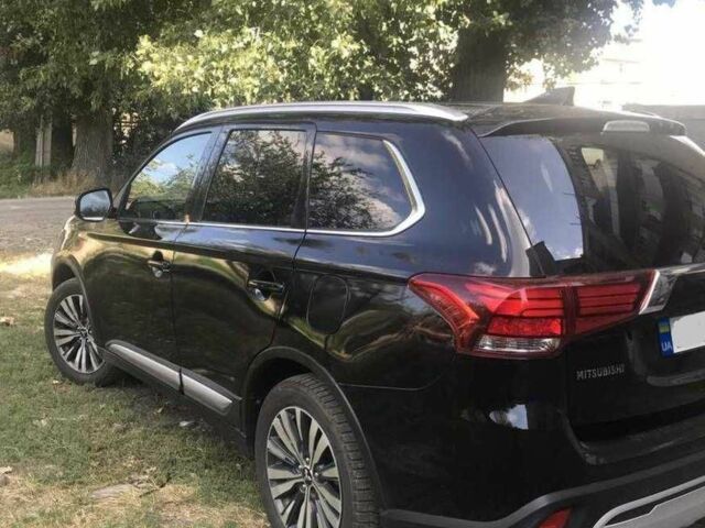 Черный Мицубиси Аутлендер, объемом двигателя 2.4 л и пробегом 125 тыс. км за 11200 $, фото 4 на Automoto.ua