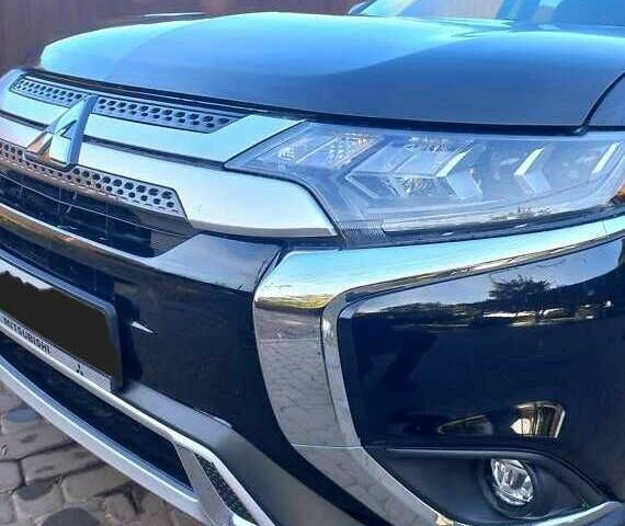 Черный Мицубиси Аутлендер, объемом двигателя 2.4 л и пробегом 132 тыс. км за 17600 $, фото 1 на Automoto.ua