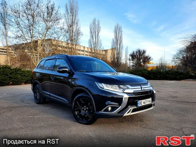 Черный Мицубиси Аутлендер, объемом двигателя 2.4 л и пробегом 130 тыс. км за 16499 $, фото 1 на Automoto.ua