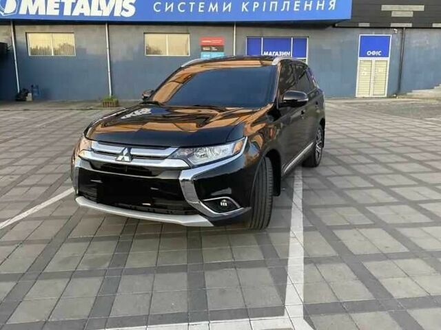 Черный Мицубиси Аутлендер, объемом двигателя 2.4 л и пробегом 75 тыс. км за 13000 $, фото 2 на Automoto.ua