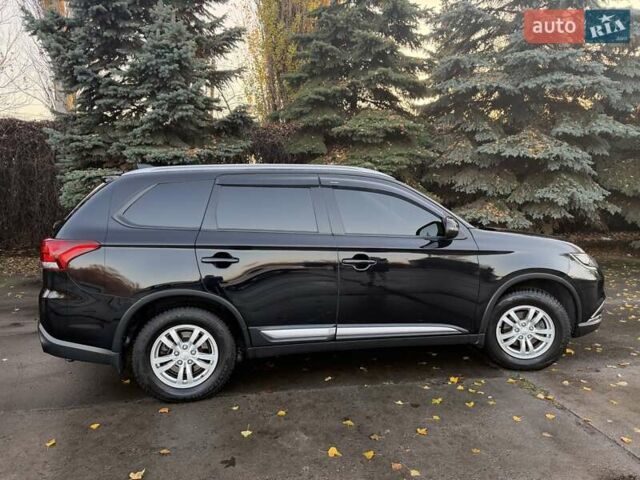 Чорний Міцубісі Аутлендер, об'ємом двигуна 2 л та пробігом 81 тис. км за 18950 $, фото 1 на Automoto.ua