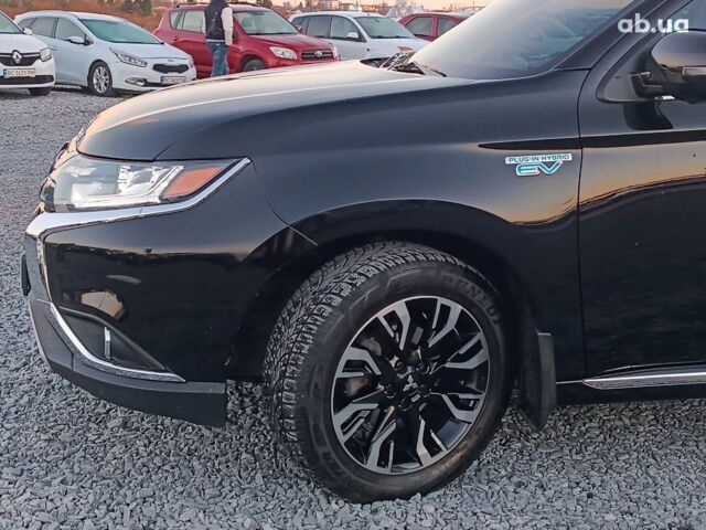 Черный Мицубиси Аутлендер, объемом двигателя 2 л и пробегом 115 тыс. км за 23700 $, фото 1 на Automoto.ua