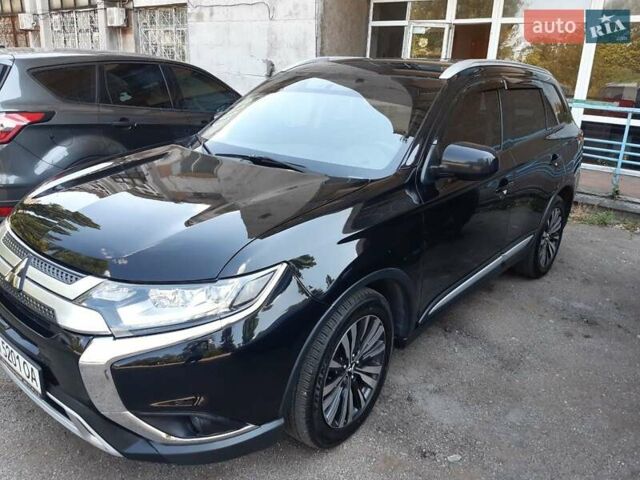 Чорний Міцубісі Аутлендер, об'ємом двигуна 2.4 л та пробігом 82 тис. км за 17499 $, фото 2 на Automoto.ua