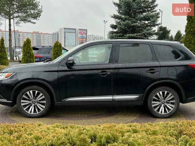 Черный Мицубиси Аутлендер, объемом двигателя 2.36 л и пробегом 144 тыс. км за 16900 $, фото 3 на Automoto.ua