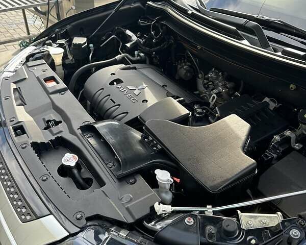 Черный Мицубиси Аутлендер, объемом двигателя 2.36 л и пробегом 90 тыс. км за 26500 $, фото 42 на Automoto.ua