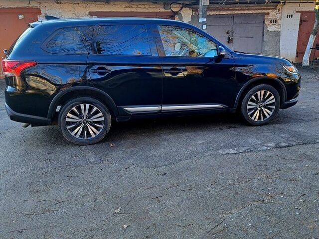 Чорний Міцубісі Аутлендер, об'ємом двигуна 2.4 л та пробігом 102 тис. км за 19200 $, фото 1 на Automoto.ua