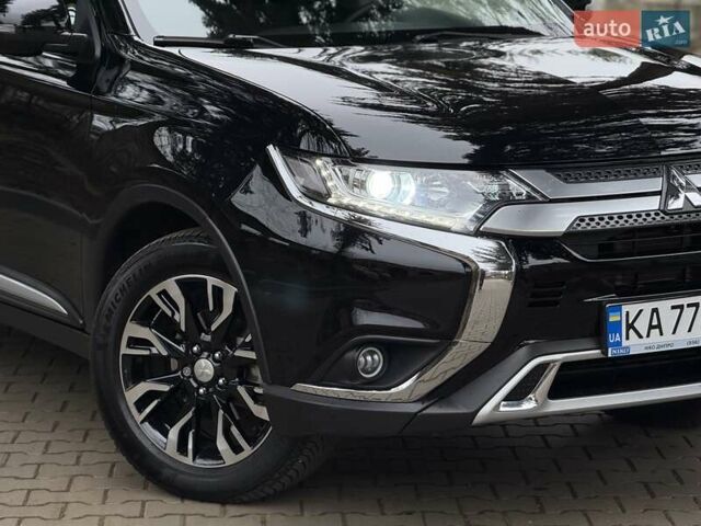 Черный Мицубиси Аутлендер, объемом двигателя 2 л и пробегом 65 тыс. км за 19950 $, фото 4 на Automoto.ua