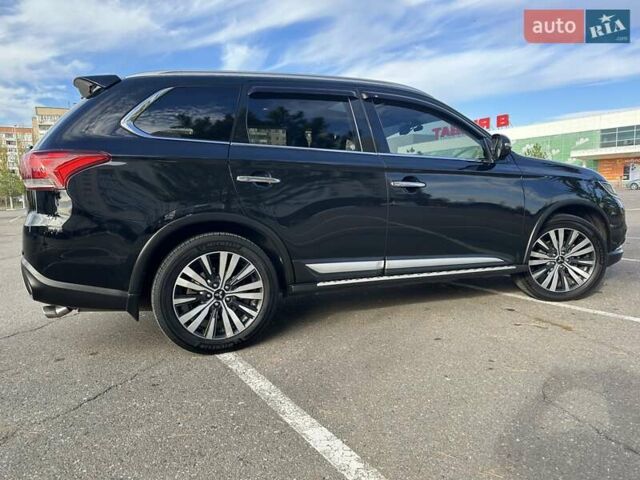 Черный Мицубиси Аутлендер, объемом двигателя 2.36 л и пробегом 90 тыс. км за 26500 $, фото 4 на Automoto.ua