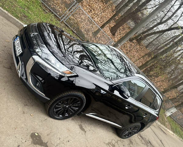 Черный Мицубиси Аутлендер, объемом двигателя 2 л и пробегом 148 тыс. км за 21800 $, фото 6 на Automoto.ua