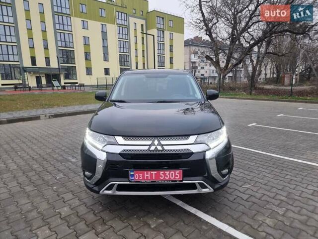 Черный Мицубиси Аутлендер, объемом двигателя 2.36 л и пробегом 127 тыс. км за 20800 $, фото 1 на Automoto.ua