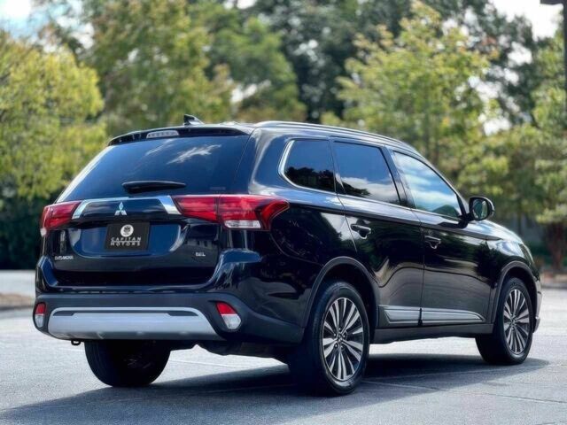 Черный Мицубиси Аутлендер, объемом двигателя 2.4 л и пробегом 46 тыс. км за 3000 $, фото 6 на Automoto.ua